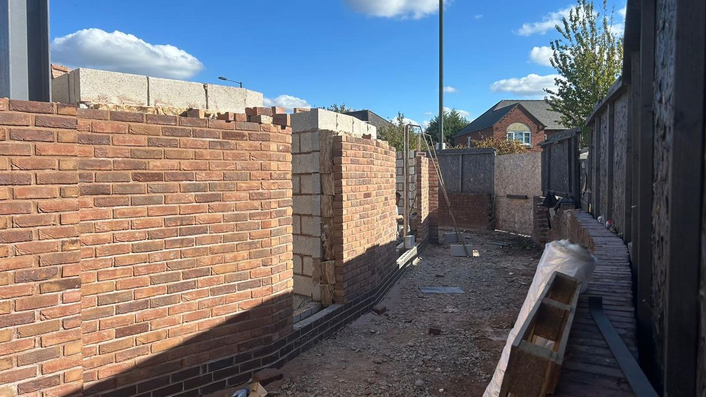 Facing brick walls going up on a multi-unit build