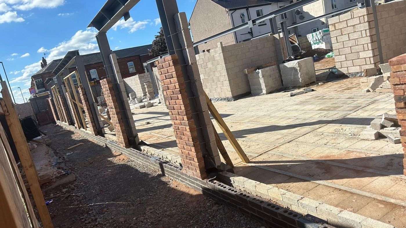 Steel frame with brick piers going up on a commercial build