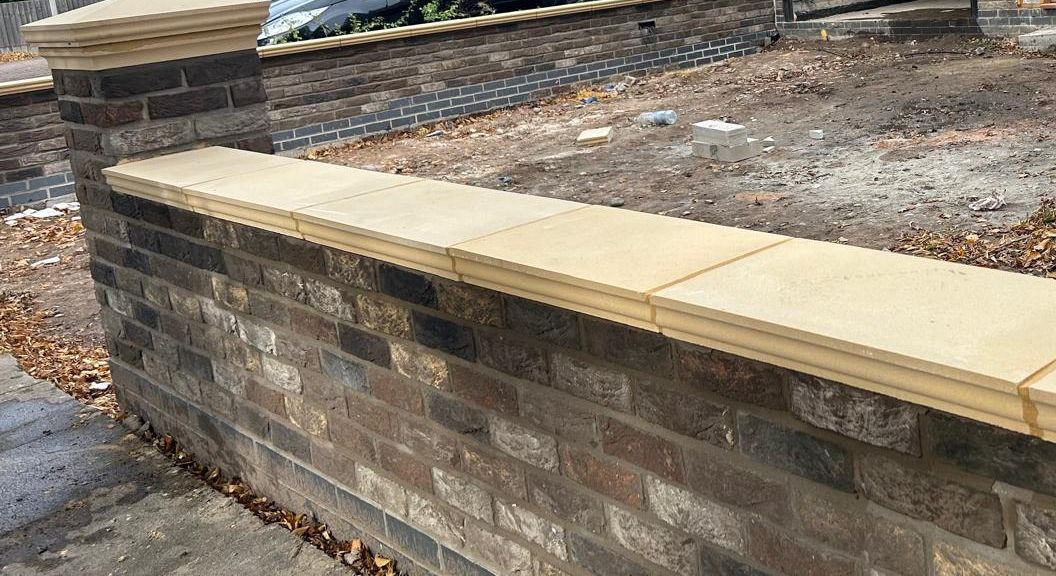 Front boundary wall in multi brick with sandstone coping and pier cap